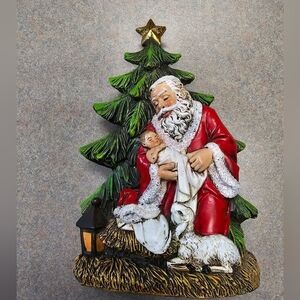 Kneeling Santa with Baby Jesus Ceramic Figure Christmas Nativity